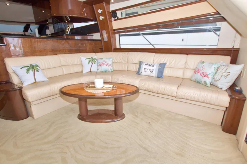 Bliss Yacht Photos Pics Luxurious 2005 Neptunus 62 Flybridge yacht interior with plush seating and decorative pillows.