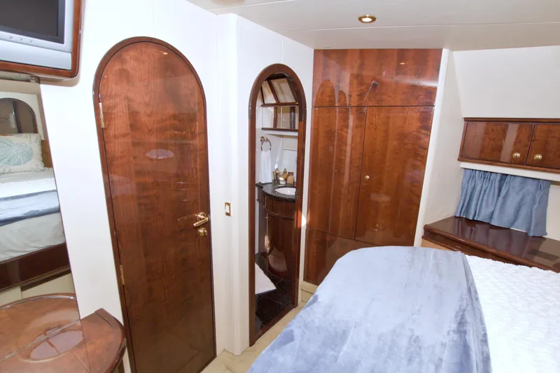 Bliss Yacht Photos Pics Luxurious 2005 Neptunus 62 Flybridge yacht interior with elegant wood finishes.