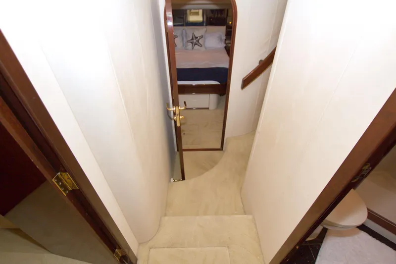 Bliss Yacht Photos Pics Interior hallway of 2005 Neptunus 62 Flybridge yacht, leading to bedroom.