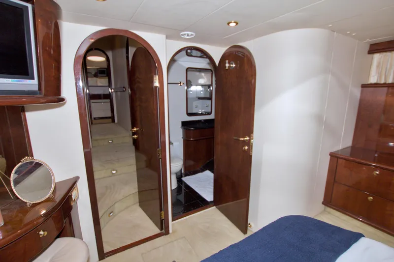 Bliss Yacht Photos Pics Luxurious interior of 2005 Neptunus 62 Flybridge yacht with elegant wood finishes.