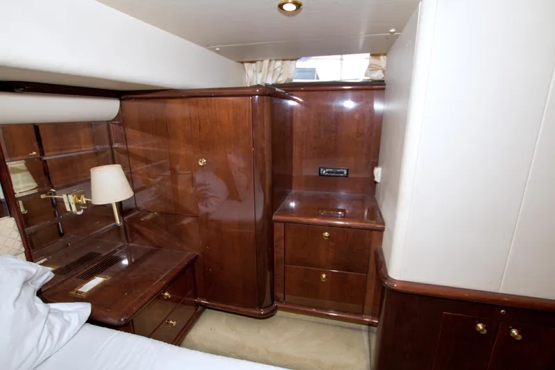 Bliss Yacht Photos Pics Luxurious wood interior of 2005 Neptunus 62 Flybridge yacht cabin.