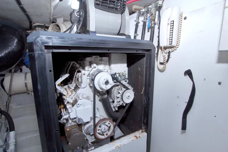 Bliss Yacht Photos Pics Engine room of 2005 Neptunus 62 Flybridge yacht, featuring mechanical components and equipment.