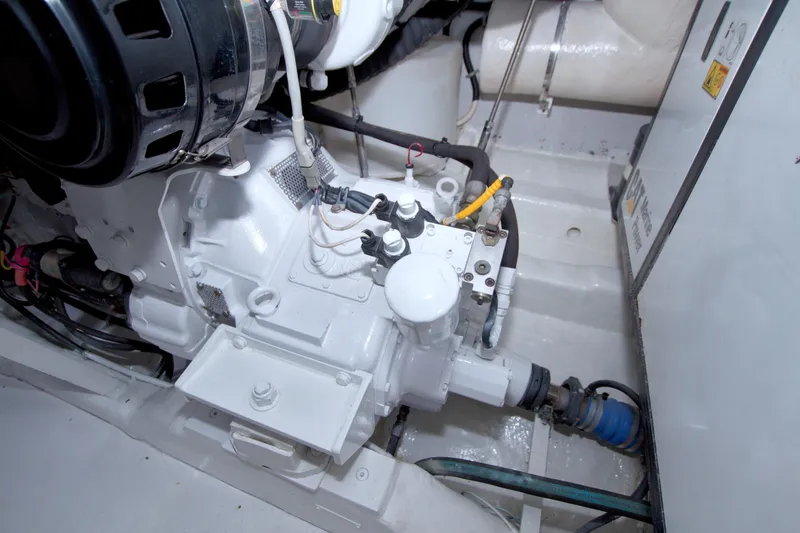 Bliss Yacht Photos Pics Engine room of 2005 Neptunus 62 Flybridge yacht, showcasing mechanical components.
