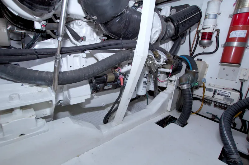 Bliss Yacht Photos Pics Engine room of 2005 Neptunus 62 Flybridge yacht, showcasing mechanical components and systems.