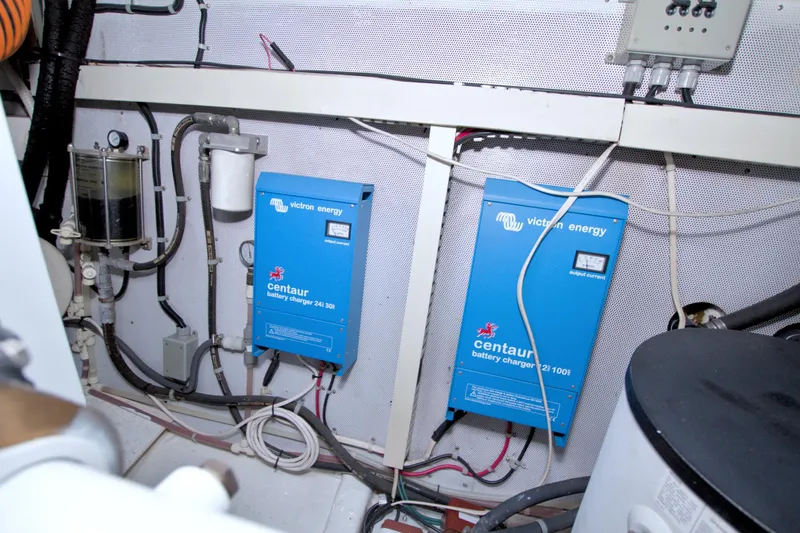 Bliss Yacht Photos Pics Engine room of 2005 Neptunus 62 Flybridge with Victron Energy battery chargers.