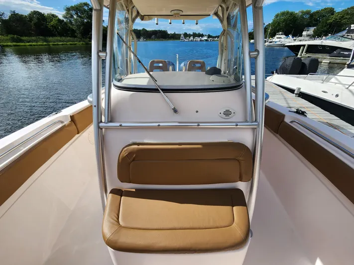  Yacht Photos Pics 2008 Grady-White 306 Bimini CC boat interior with tan seating, docked by the water.