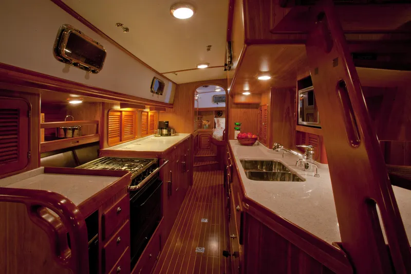 Providence Yacht Photos Pics Luxurious interior of 2013 Passport 470 Center Cockpit yacht with modern kitchen amenities.