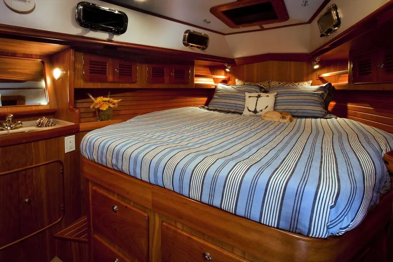 Providence Yacht Photos Pics Luxurious cabin interior of 2013 Passport 470 Center Cockpit yacht with striped bedding.