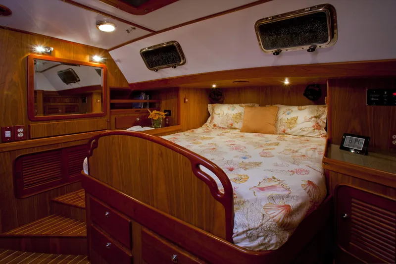 Providence Yacht Photos Pics Luxurious cabin interior of 2013 Passport 470 Center Cockpit yacht with cozy bed and wooden finish.