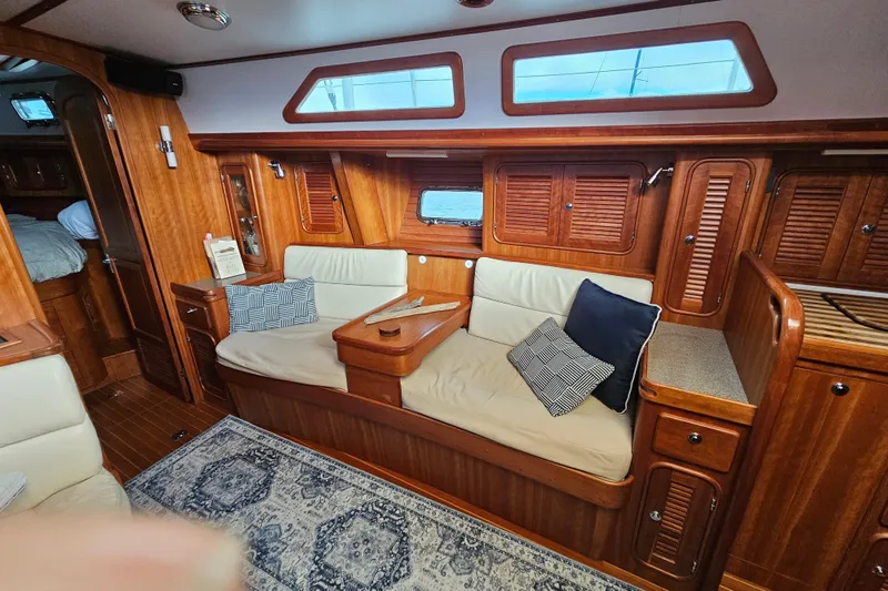 Providence Yacht Photos Pics Interior of 2013 Passport 470 Center Cockpit yacht with wooden finish and cozy seating.