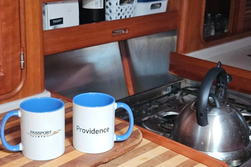 Providence Yacht Photos Pics Mugs and kettle in 2013 Passport 470 Center Cockpit yacht kitchen.