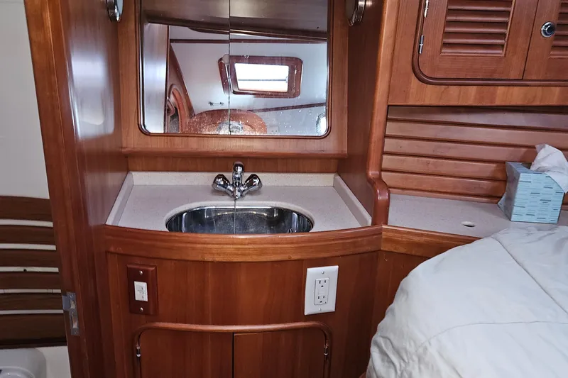 Providence Yacht Photos Pics Interior of 2013 Passport 470 Center Cockpit yacht with wooden cabinetry and sink.