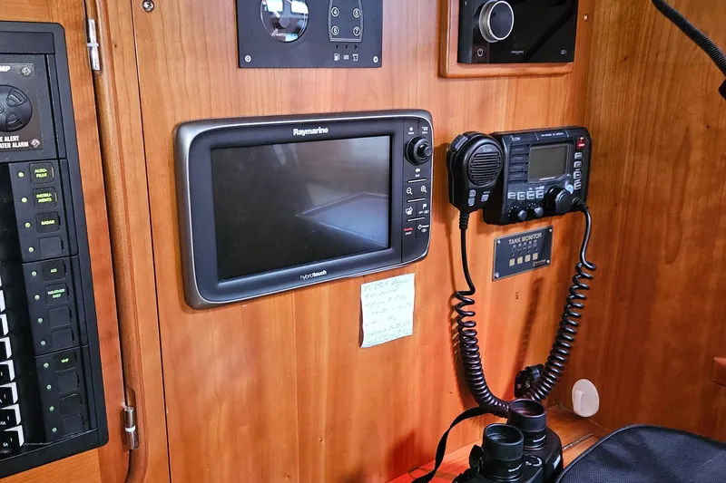 Providence Yacht Photos Pics Navigation equipment on 2013 Passport 470 Center Cockpit yacht, featuring Raymarine and Icom devices.