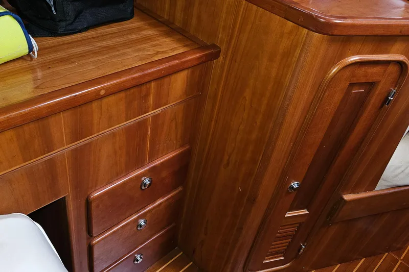 Providence Yacht Photos Pics Interior of 2013 Passport 470 Center Cockpit, featuring polished wooden cabinetry and drawers.