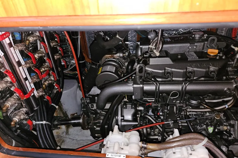 Providence Yacht Photos Pics Engine compartment of a 2013 Passport 470 Center Cockpit sailboat, showcasing detailed mechanical components.