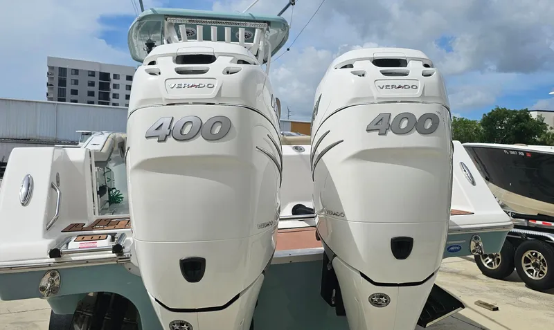  Yacht Photos Pics 2022 Tidewater 320 CC Adventure with twin 400 Verado engines, docked outdoors.