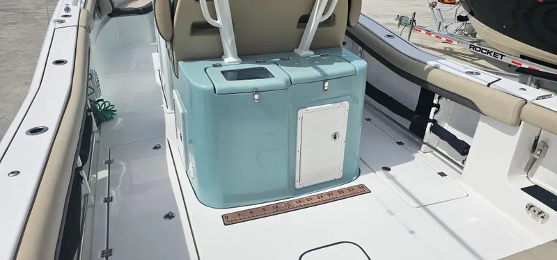  Yacht Photos Pics 2022 Tidewater 320 CC Adventure boat interior with seating and storage.