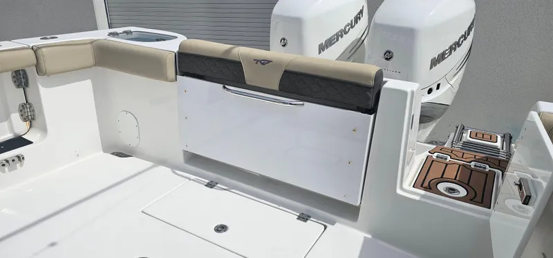  Yacht Photos Pics 2022 Tidewater 320 CC Adventure boat with Mercury engines, featuring spacious deck and seating.