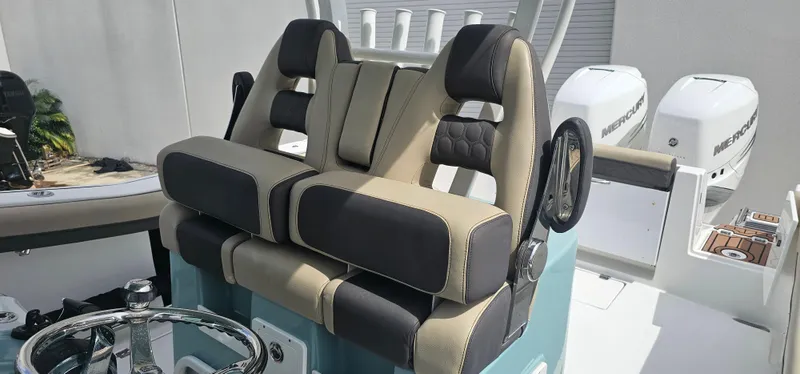  Yacht Photos Pics 2022 Tidewater 320 CC Adventure boat seating and helm with dual Mercury engines.