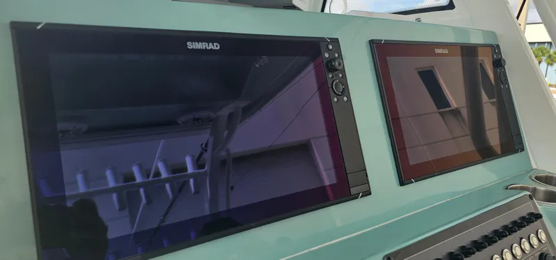  Yacht Photos Pics Simrad displays on 2022 Tidewater 320 CC Adventure boat dashboard.