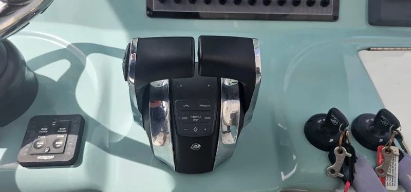  Yacht Photos Pics Throttle controls on a 2022 Tidewater 320 CC Adventure boat dashboard.