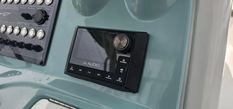  Yacht Photos Pics JL Audio system on 2022 Tidewater 320 CC Adventure boat dashboard.