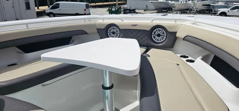  Yacht Photos Pics Interior of 2022 Tidewater 320 CC Adventure boat with seating and table.