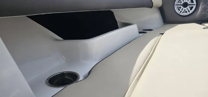  Yacht Photos Pics Interior of 2022 Tidewater 320 CC Adventure boat with speaker and cup holder.