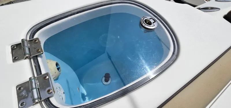  Yacht Photos Pics Livewell on 2022 Tidewater 320 CC Adventure boat, featuring a clear lid and secure latch.