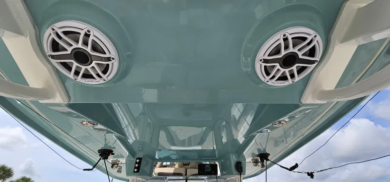  Yacht Photos Pics 2022 Tidewater 320 CC Adventure boat underside with speakers and blue hull.