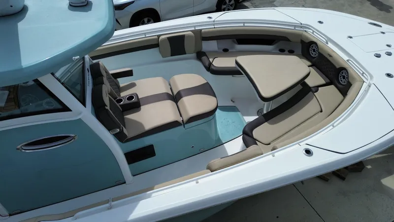  Yacht Photos Pics 2022 Tidewater 320 CC Adventure boat with spacious seating and modern design.