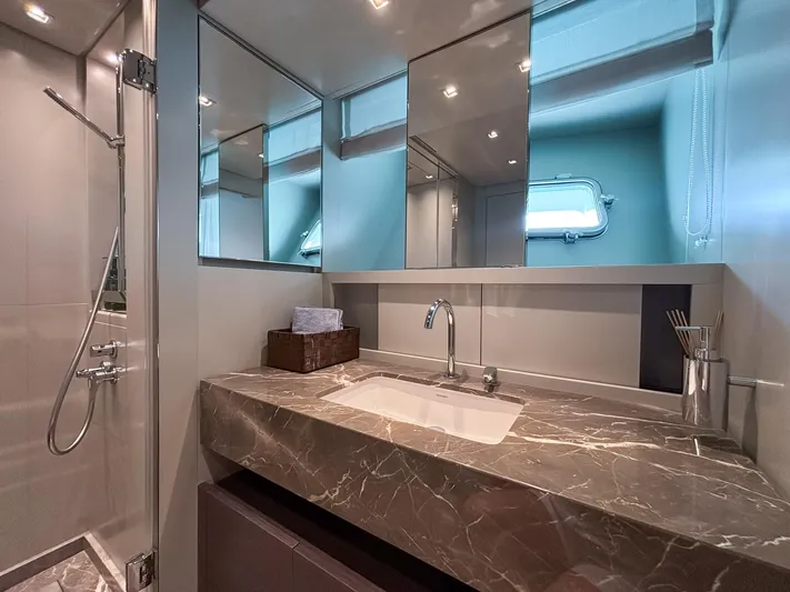  Yacht Photos Pics Luxurious bathroom in 2023 Sanlorenzo SX88 yacht with marble countertop and modern fixtures.