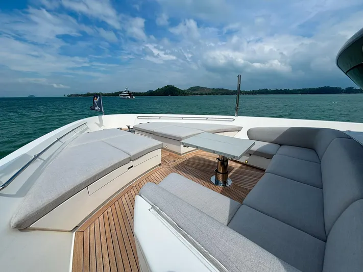  Yacht Photos Pics Luxurious Sanlorenzo SX88 yacht deck with elegant seating, 2023 model, on serene ocean waters.