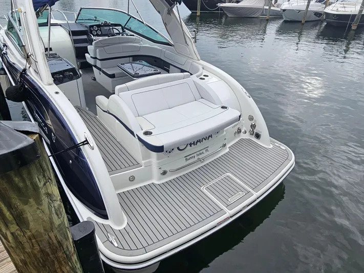  Yacht Photos Pics 2018 Formula 350 Sun Sport boat docked, featuring spacious seating and sleek design.