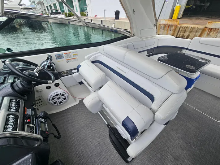  Yacht Photos Pics 2018 Formula 350 Sun Sport boat interior with plush seating and modern dashboard.