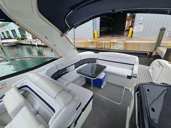  Yacht Photos Pics 2018 Formula 350 Sun Sport boat interior with white seating and a small table.