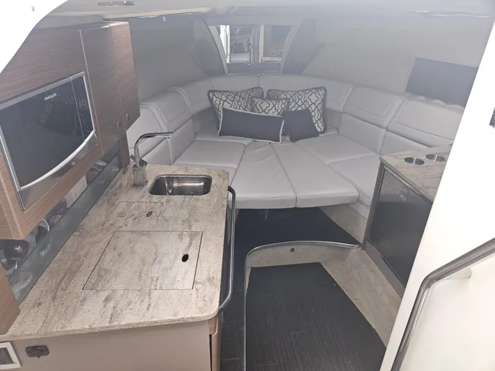  Yacht Photos Pics Interior of 2018 Formula 350 Sun Sport with kitchenette and seating area.