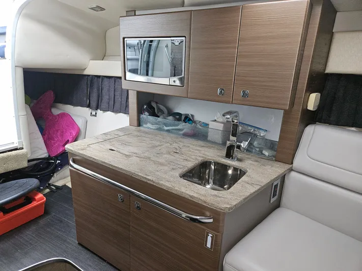  Yacht Photos Pics 2018 Formula 350 Sun Sport cabin with kitchenette, sink, and microwave.