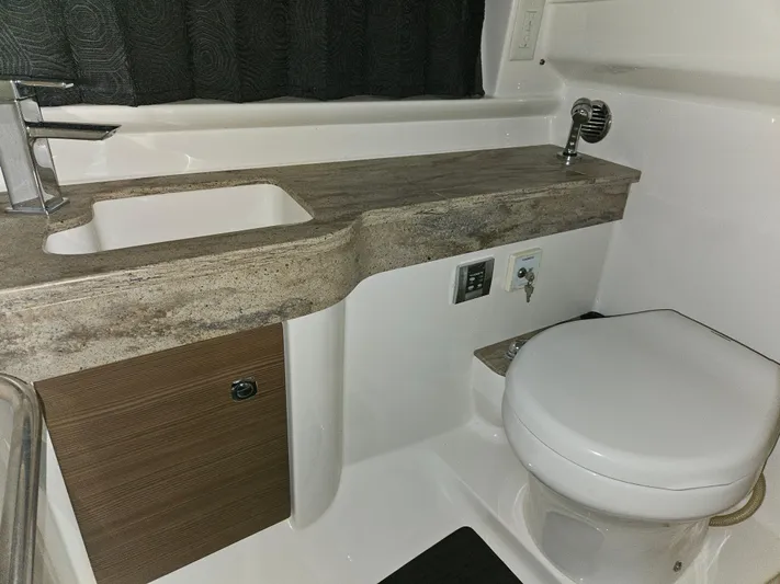  Yacht Photos Pics 2018 Formula 350 Sun Sport bathroom with modern sink and toilet.