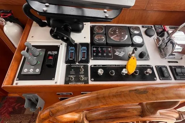 Emily Anne Yacht Photos Pics Control panel of a 2001 Island Gypsy Euro Sedan Trawler with gauges and switches.