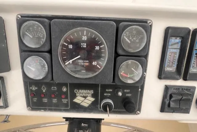 Emily Anne Yacht Photos Pics Control panel of 2001 Island Gypsy Euro Sedan Trawler with Cummins Marine gauges.