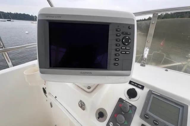 Emily Anne Yacht Photos Pics 2001 Island Gypsy Euro Sedan Trawler helm with Garmin GPS navigation system.