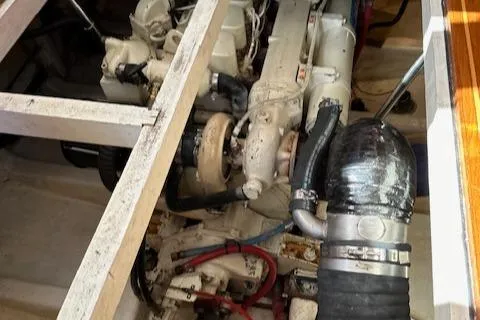 Emily Anne Yacht Photos Pics Engine compartment of a 2001 Island Gypsy Euro Sedan Trawler, showcasing mechanical components.