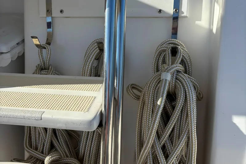 Emily Anne Yacht Photos Pics Ropes and metal railing on 2001 Island Gypsy Euro Sedan Trawler boat deck.