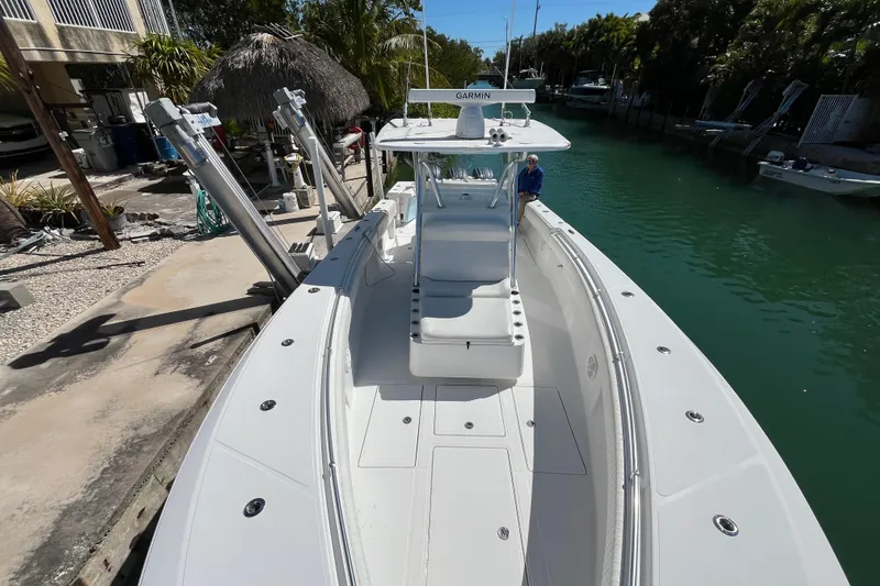  Yacht Photos Pics 2016 SeaHunter 35 Tournament boat docked by a canal, featuring a spacious deck.