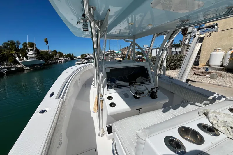 Yacht Photos Pics 2016 SeaHunter 35 Tournament boat docked, showcasing helm and seating area under clear blue sky.