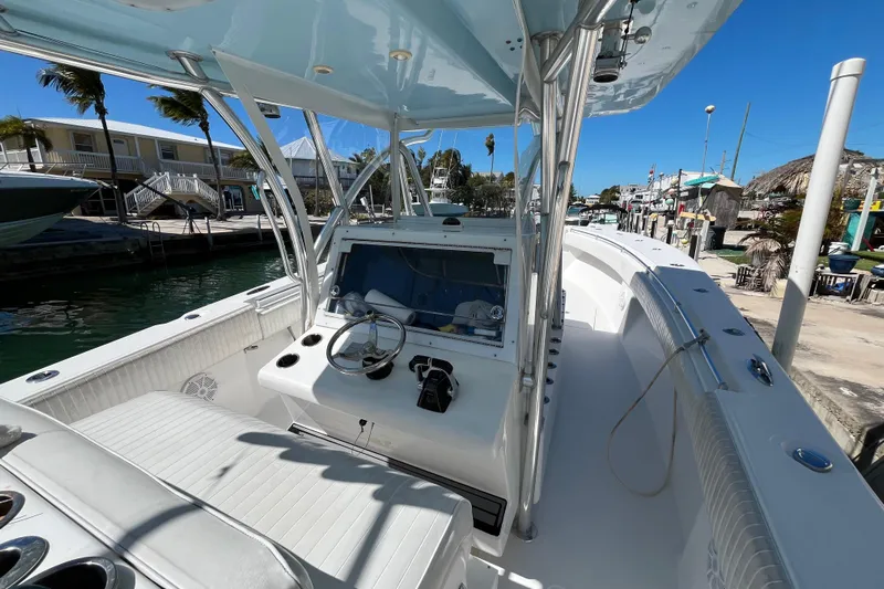  Yacht Photos Pics 2016 SeaHunter 35 Tournament boat interior with steering console and seating, docked in sunny marina.