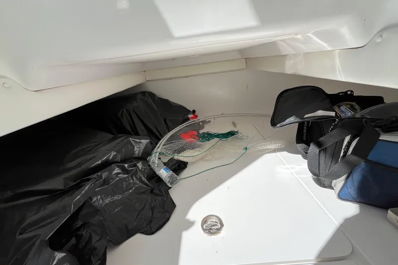  Yacht Photos Pics Interior of 2016 SeaHunter 35 Tournament boat with fishing gear and bags.