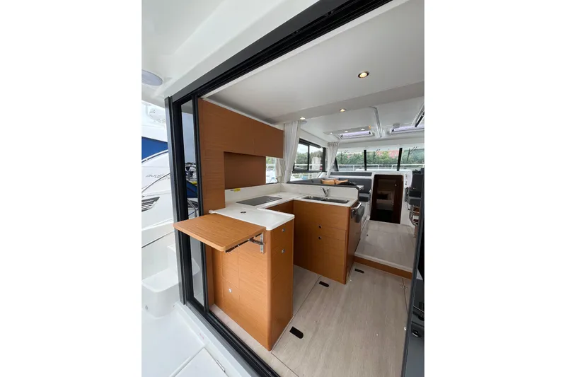  Yacht Photos Pics Interior of 2026 Beneteau 41 Swift Trawler Sedan, featuring modern kitchen and seating area.