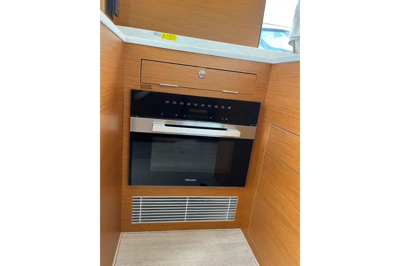  Yacht Photos Pics Modern kitchen appliance in 2026 Beneteau 41 Swift Trawler Sedan yacht interior.